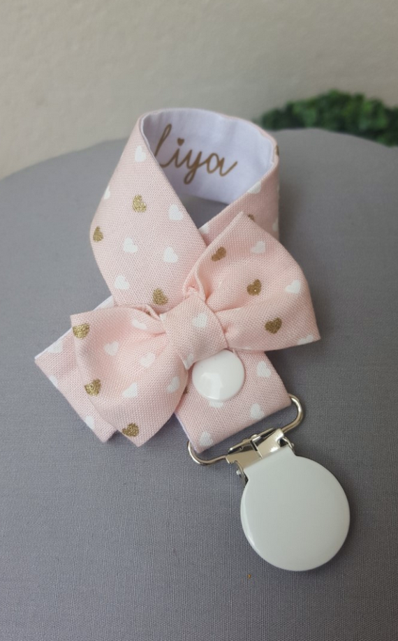 Attache tetine rose poudre coeur or